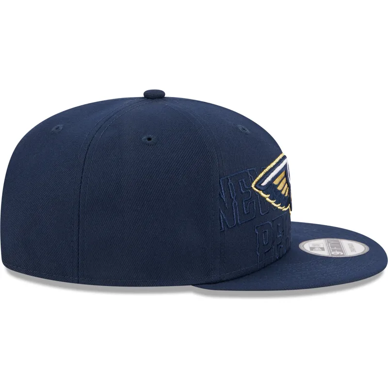 cappello-piatto-blu-navy-snapback-9fifty-draft-edition-2023-dei-new-orleans-pelicans-nba-di-new-era