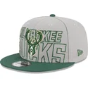 cappello-piatto-grigio-e-verde-snapback-9fifty-draft-edition-2023-di-milwaukee-bucks-nba-di-new-era