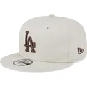 cappellino-beige-snapback-con-visiera-piatta-e-logo-marrone-9fifty-league-essential-dei-los-angeles-dodgers-mlb-di-new-era