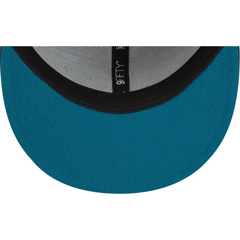 cappello-piatto-blu-navy-snapback-con-logo-blu-navy-9fifty-side-patch-script-dei-new-york-yankees-mlb-di-new-era