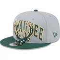 cappellino-snapback-grigio-e-verde-9fifty-tip-off-2023-dei-milwaukee-bucks-nba-di-new-era