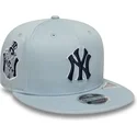 cappello-piatto-blu-snapback-con-logo-blu-marino-9fifty-original-fit-world-series-dei-new-york-yankees-mlb-di-new-era