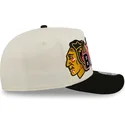 cappellino-visiera-curva-beige-e-nero-snapback-9fifty-a-frame-classic-di-chicago-blackhawks-nhl-di-new-era