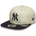 cappello-piatto-beige-snapback-con-logo-blu-marino-9fifty-original-fit-world-series-dei-new-york-yankees-mlb-di-new-era