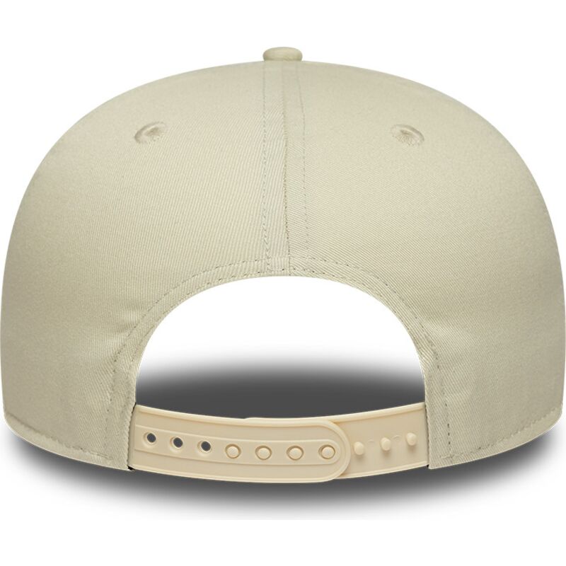 cappello-piatto-beige-snapback-con-logo-blu-marino-9fifty-original-fit-world-series-dei-new-york-yankees-mlb-di-new-era