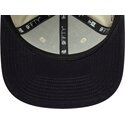 cappello-piatto-beige-snapback-con-logo-blu-marino-9fifty-original-fit-world-series-dei-new-york-yankees-mlb-di-new-era