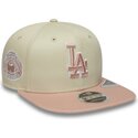 cappello-piatto-beige-snapback-con-logo-rosa-9fifty-original-fit-world-series-patch-dei-los-angeles-dodgers-mlb-di-new-era